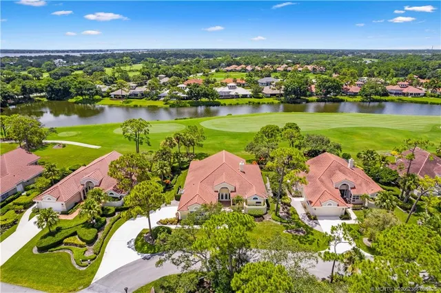 an aerial view of a house with a lake view