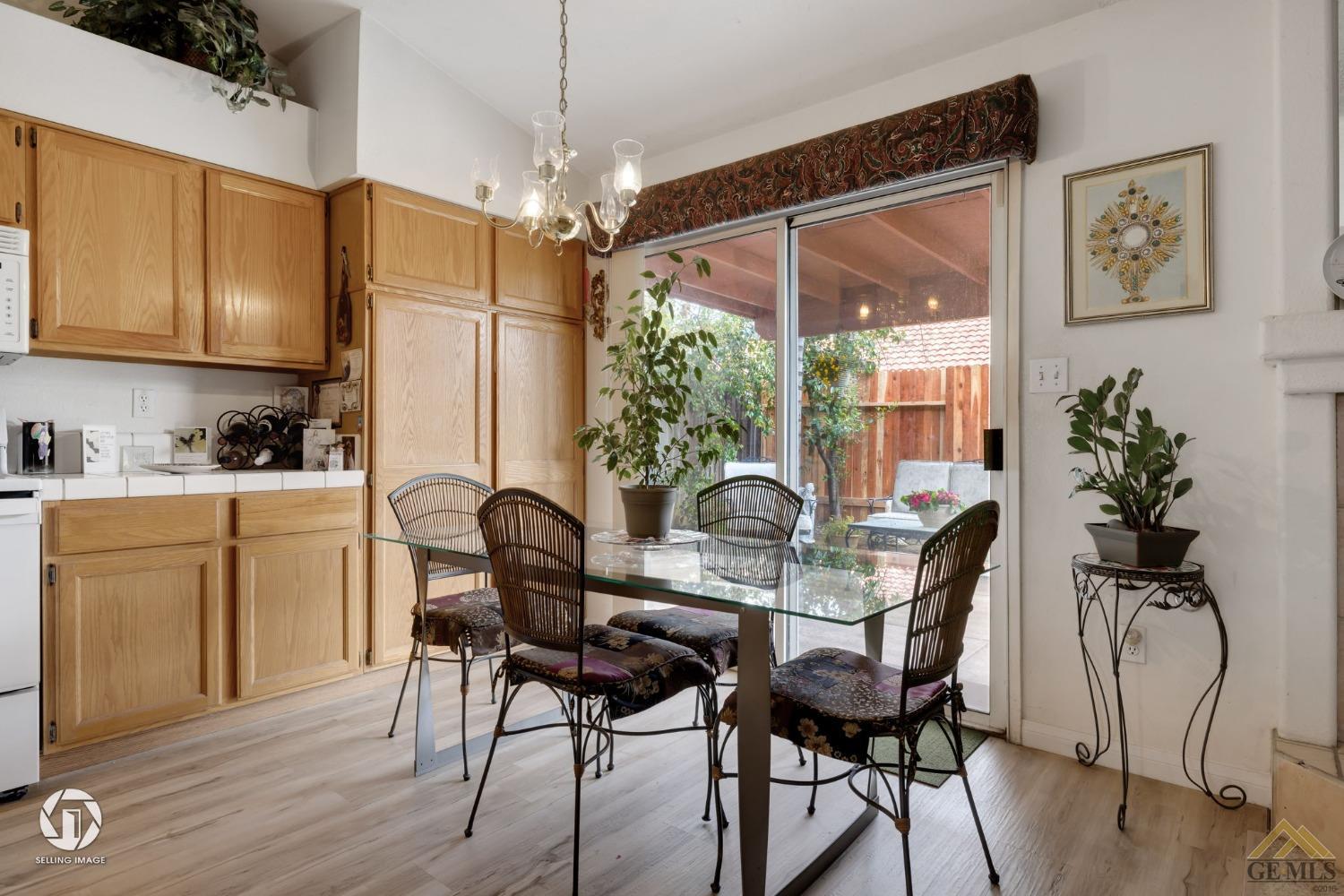 Undisclosed Address Bakersfield, CA 93312 - Photo 11 of 33 a view of a dining room with furniture window and wooden floor