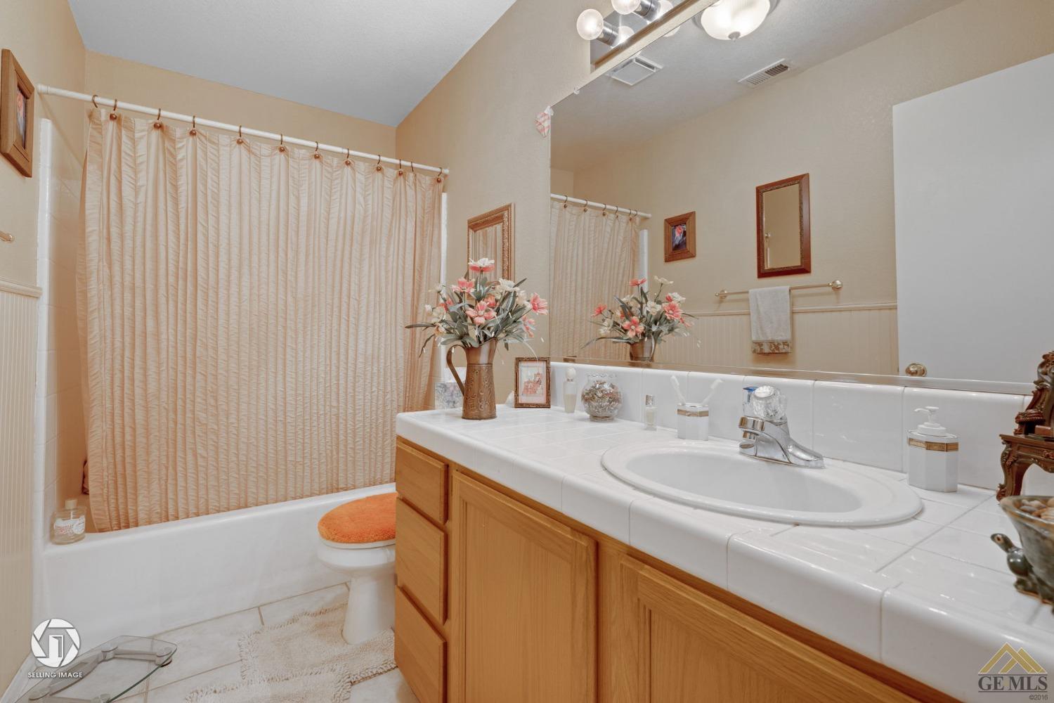 Undisclosed Address Bakersfield, CA 93312 - Photo 18 of 33 a bathroom with a sink toilet and shower