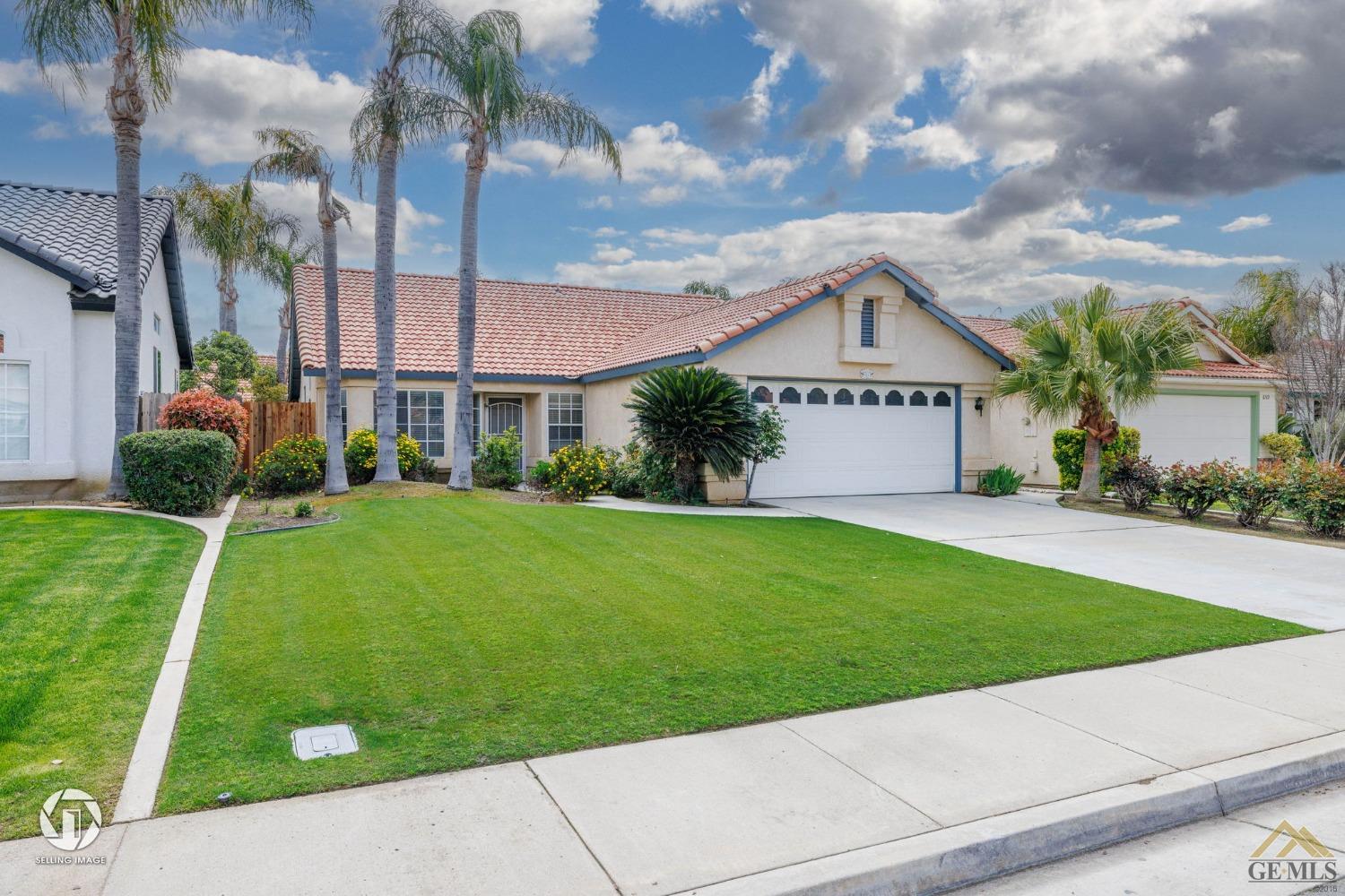 Undisclosed Address Bakersfield, CA 93312 - Photo 3 of 33 a front view of a house with a yard
