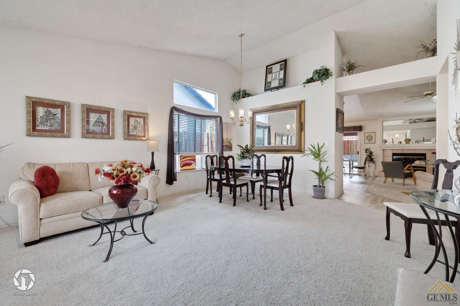 Undisclosed Address Bakersfield, CA 93312 - Photo 4 of 33 a living room with furniture and a large window