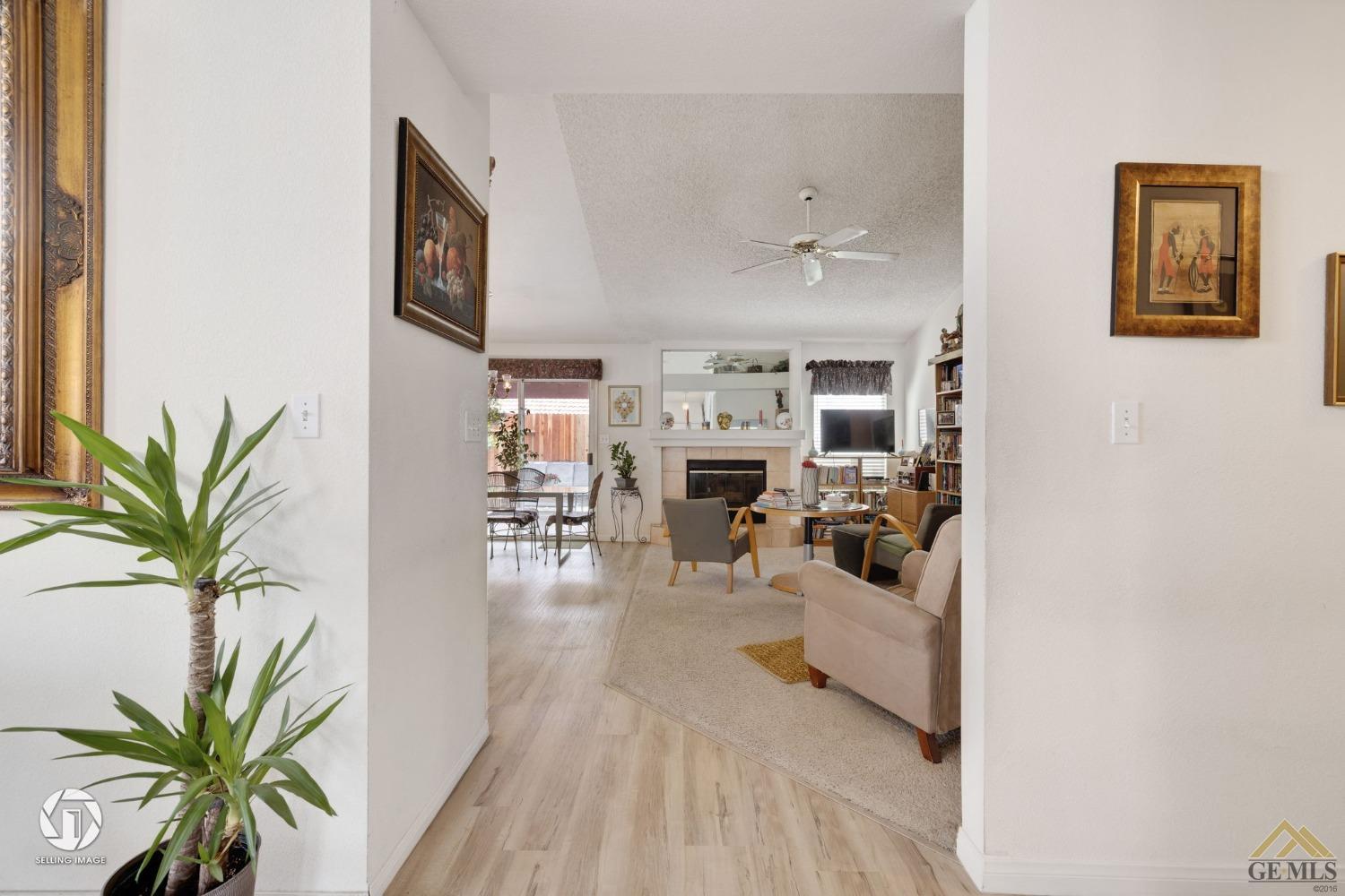 Undisclosed Address Bakersfield, CA 93312 - Photo 5 of 33 a view of a livingroom with furniture and a ceiling fan