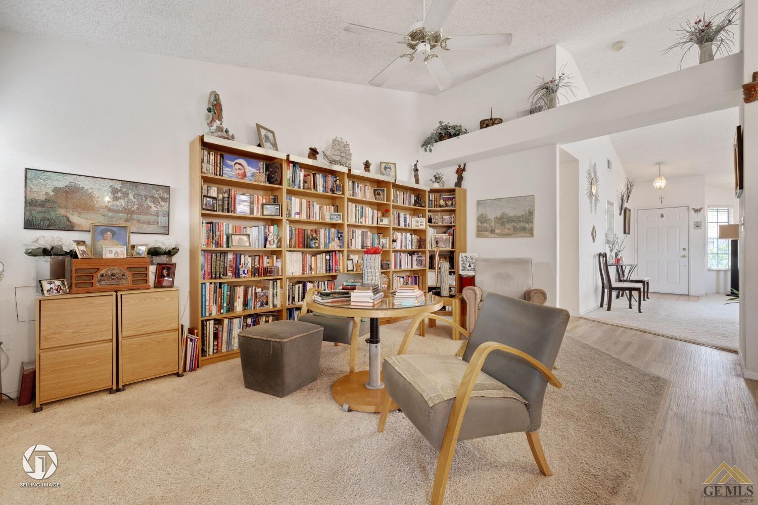 Undisclosed Address Bakersfield, CA 93312 - Photo 7 of 33 a dining room with furniture and a book shelf