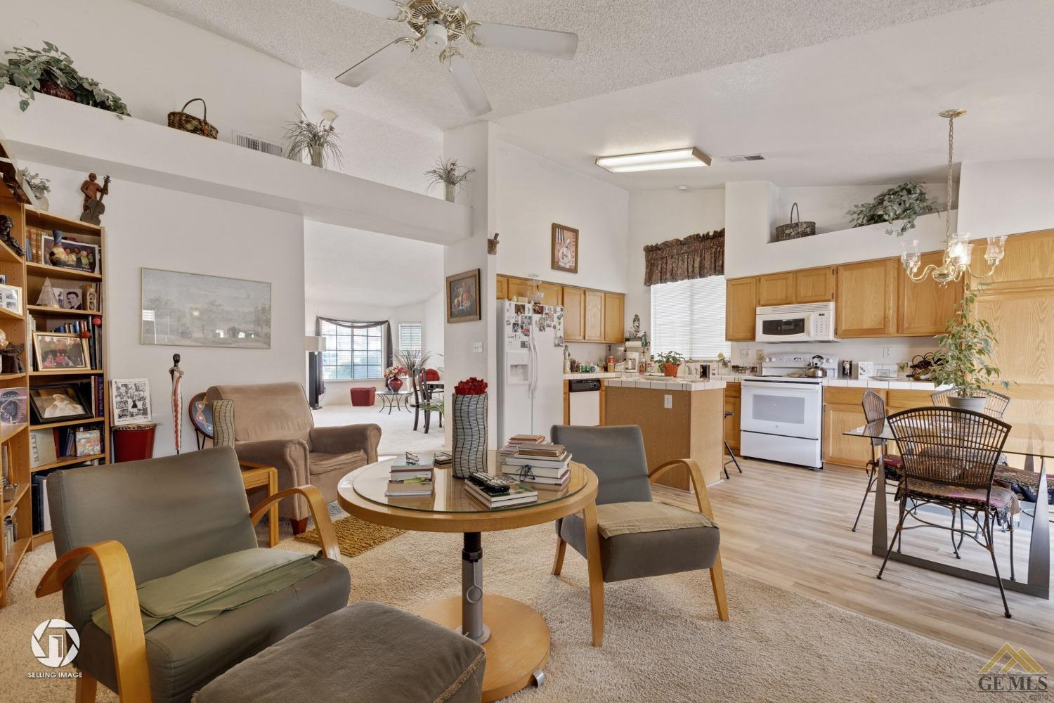 Undisclosed Address Bakersfield, CA 93312 - Photo 8 of 33 a living room with lots of furniture and kitchen view