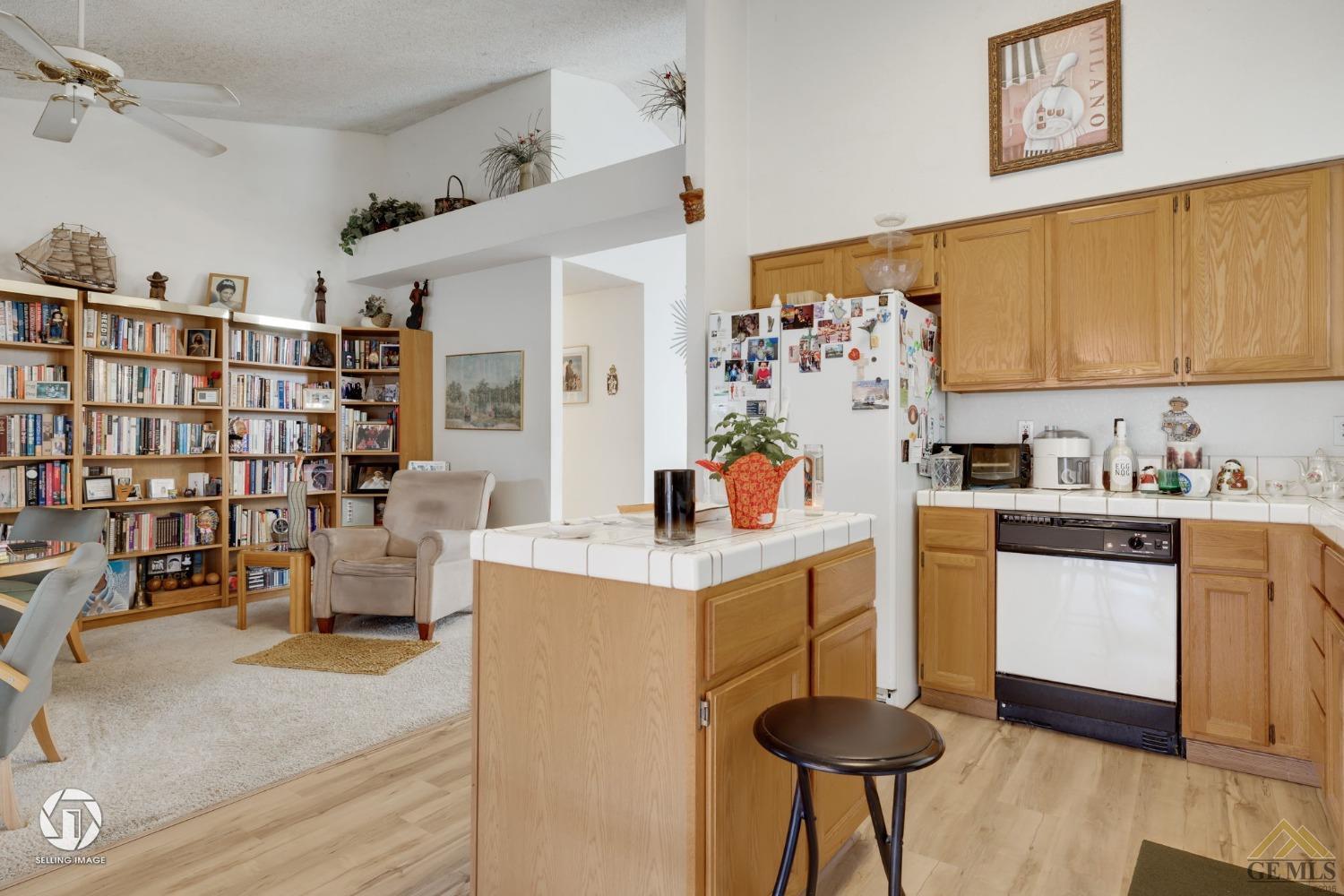 Undisclosed Address Bakersfield, CA 93312 - Photo 10 of 33 a kitchen with stainless steel appliances granite countertop a stove and a refrigerator