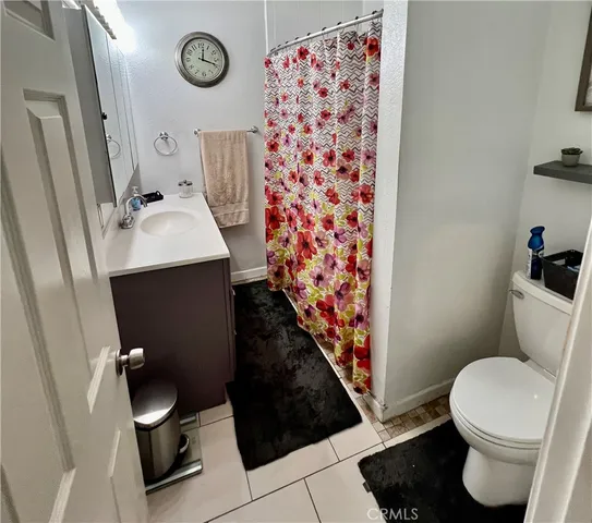 a bathroom with a toilet and a sink