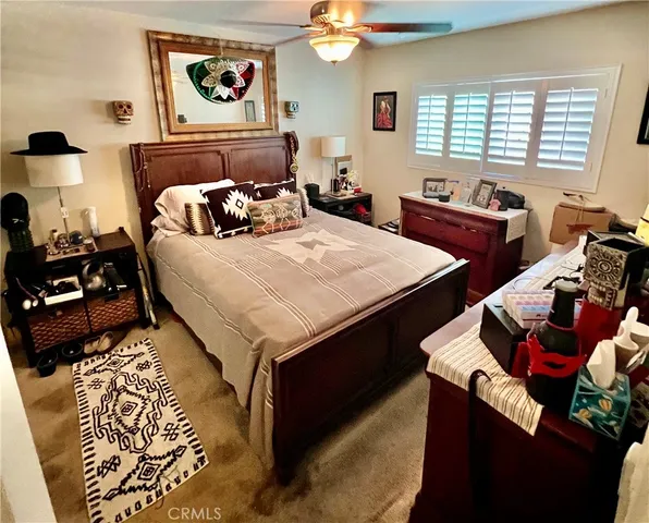 a bedroom with bed and a window