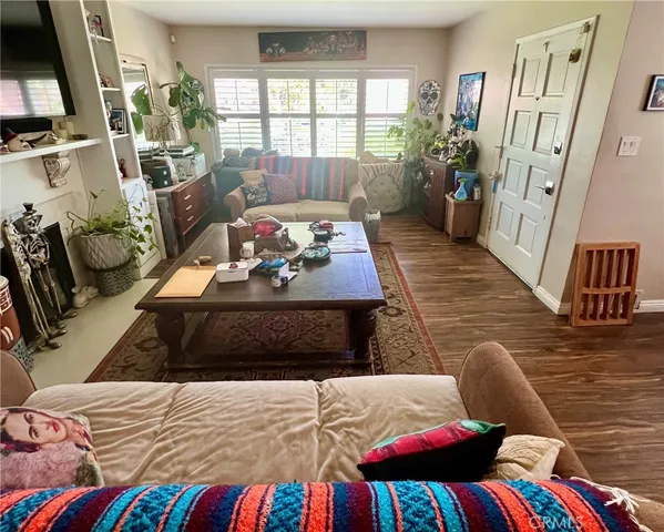 a bedroom with a bed window and a couch