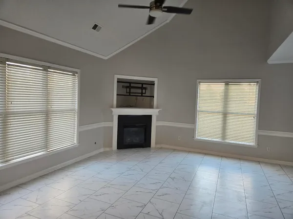 a kitchen with granite countertop a refrigerator and a sink
