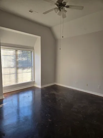 an empty room with windows