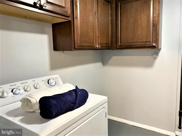 a bathroom with a sink and cabinets