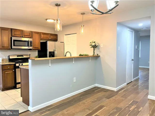 a view of a kitchen with a sink and dishwasher