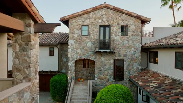a view of a swimming pool with a patio and a garden