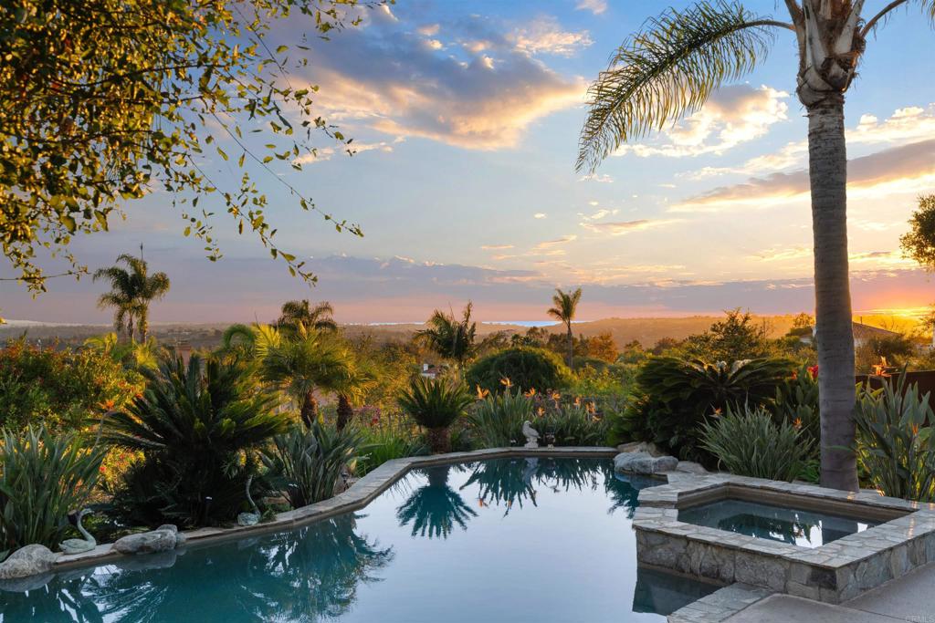 Undisclosed Address Encinitas, CA 92024 - Photo 13 of 30 a view of a swimming pool with a patio and a garden
