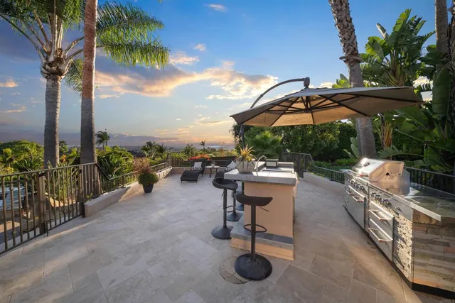 a dining room with furniture and a floor to ceiling window