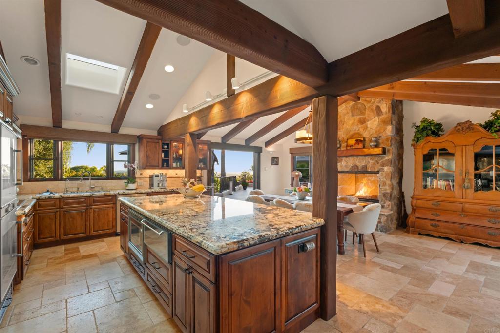 Undisclosed Address Encinitas, CA 92024 - Photo 17 of 30 a kitchen with granite countertop sink and cabinets