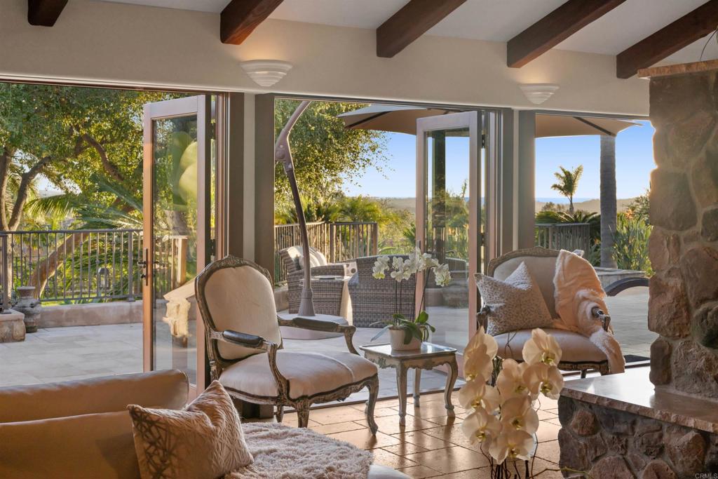 Undisclosed Address Encinitas, CA 92024 - Photo 22 of 30 a living room with furniture and a floor to ceiling window