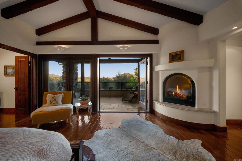 Undisclosed Address Encinitas, CA 92024 - Photo 23 of 30 a living room with furniture and a fireplace