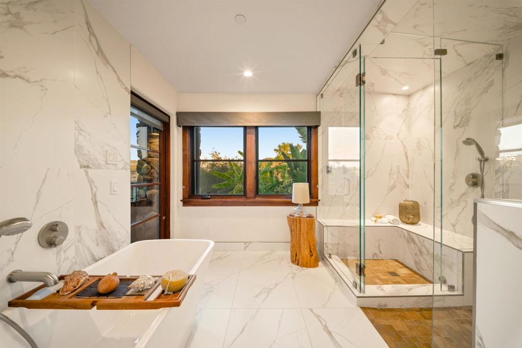 Undisclosed Address Encinitas, CA 92024 - Photo 28 of 30 a bedroom with a bed and a large window