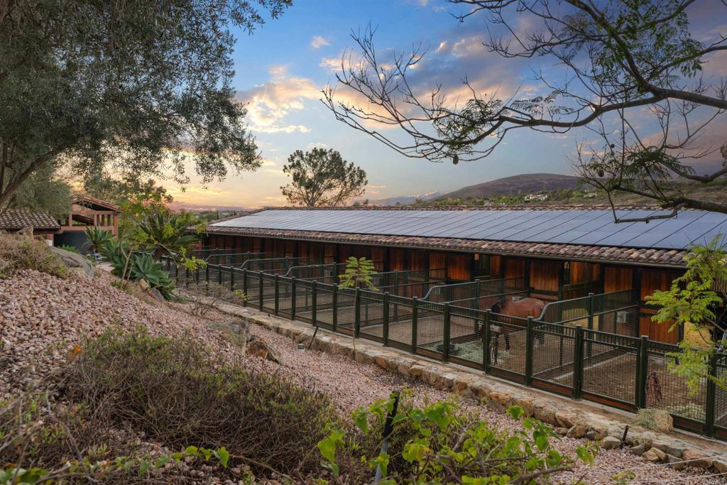 Undisclosed Address Encinitas, CA 92024 - Photo 3 of 30 a view of a house with a wooden fence