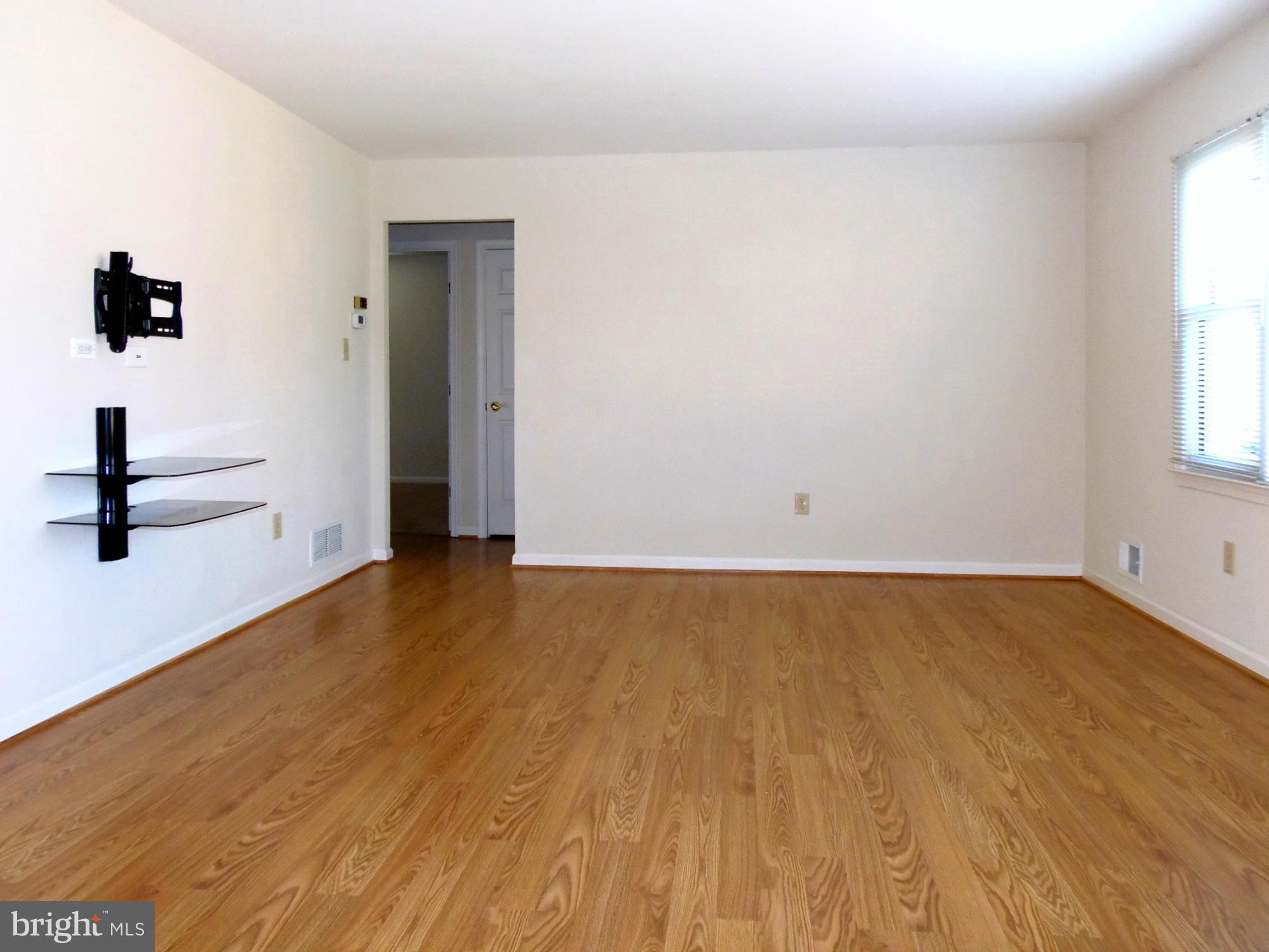 9560 North Laurel Road Laurel, MD 20723 - Photo 6 of 30 Living Room w/ TV Mount Conveys