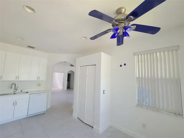 a view of a kitchen with a sink and cabinet area