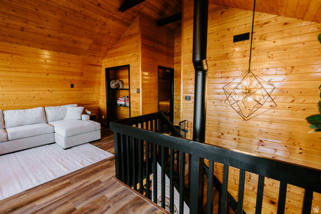 1413 Basel Drive Midway, UT 84049 - Photo 54 of 137 Living room with wood walls, a wooden ceiling with exposed beams, and wood finished floors