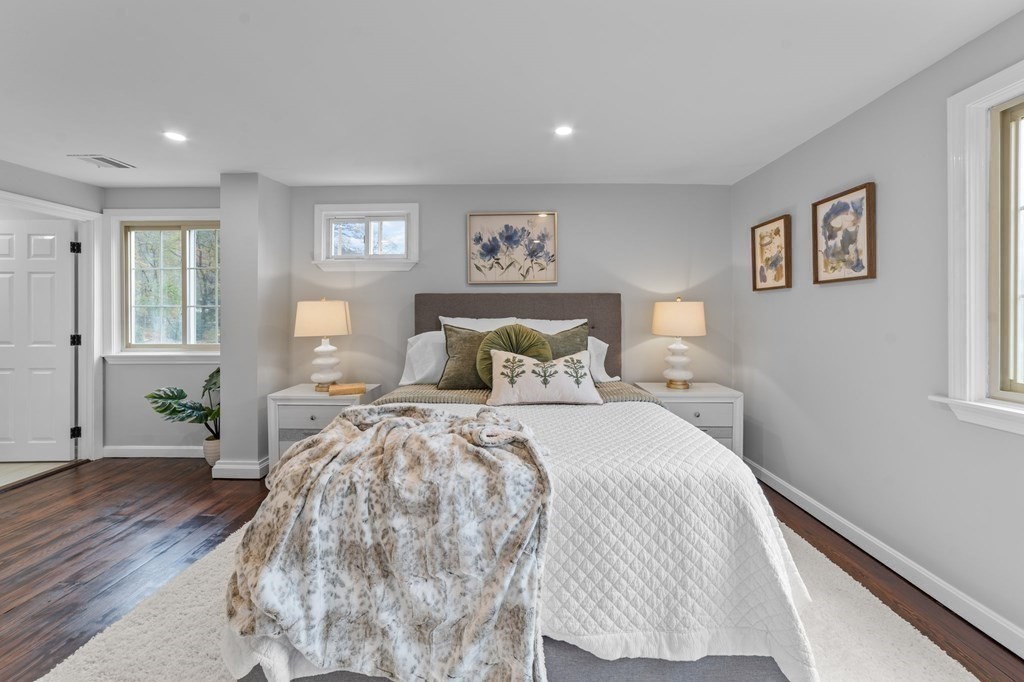 38 Wayside Lane Ashland, MA 01721 - Photo 23 of 40 a bedroom with a bed and wooden floor