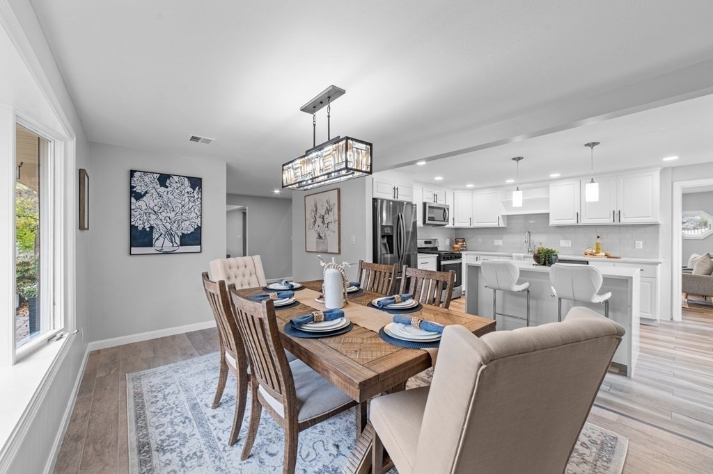 38 Wayside Lane Ashland, MA 01721 - Photo 8 of 40 a view of a dining room with furniture