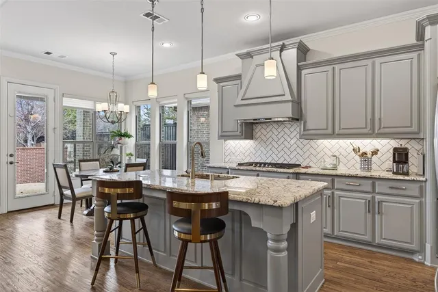 a spacious bathroom with a double vanity sink a mirror and a bathtub