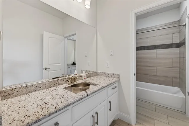 a bathroom with a sink toilet and vanity