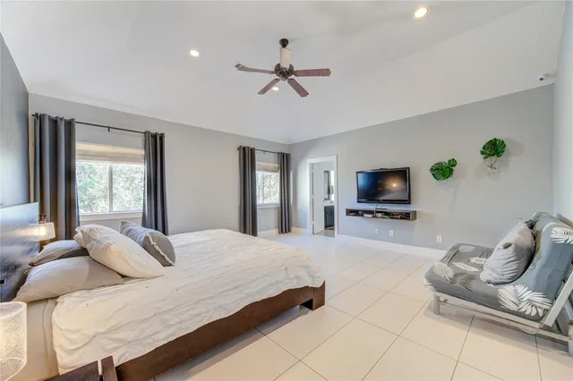 a bedroom with a bed and a couch