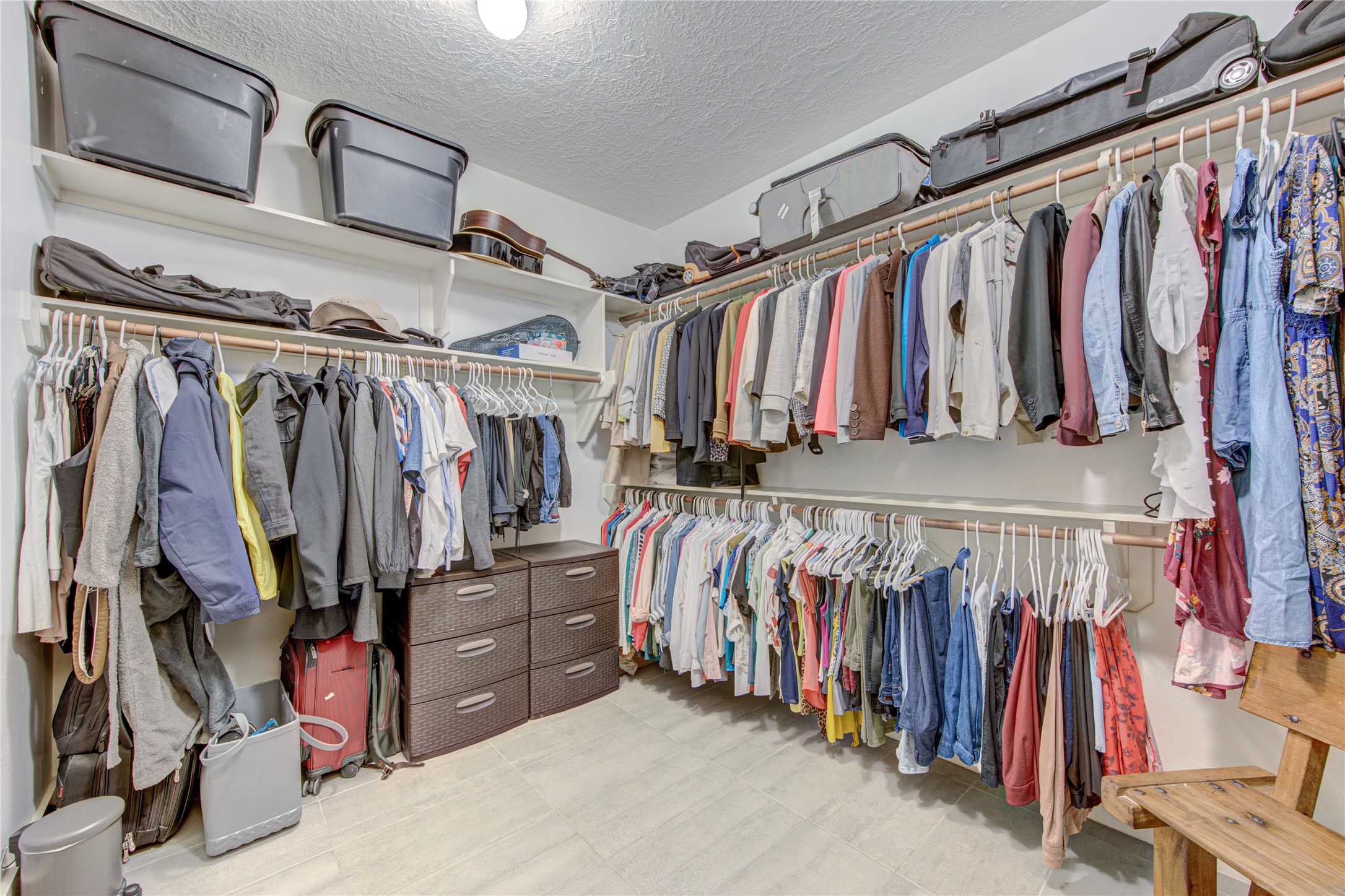 1419 Baldwin Square Lane Houston, TX 77077 - Photo 29 of 45 Spacious master closet with ample hanging space and built-in storage, perfect for organizing your wardrobe.