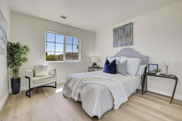 a bedroom with a bed and a couch