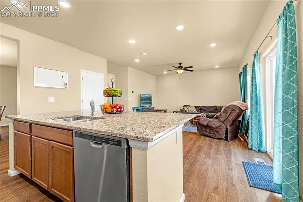 a kitchen with stainless steel appliances granite countertop a stove and a sink