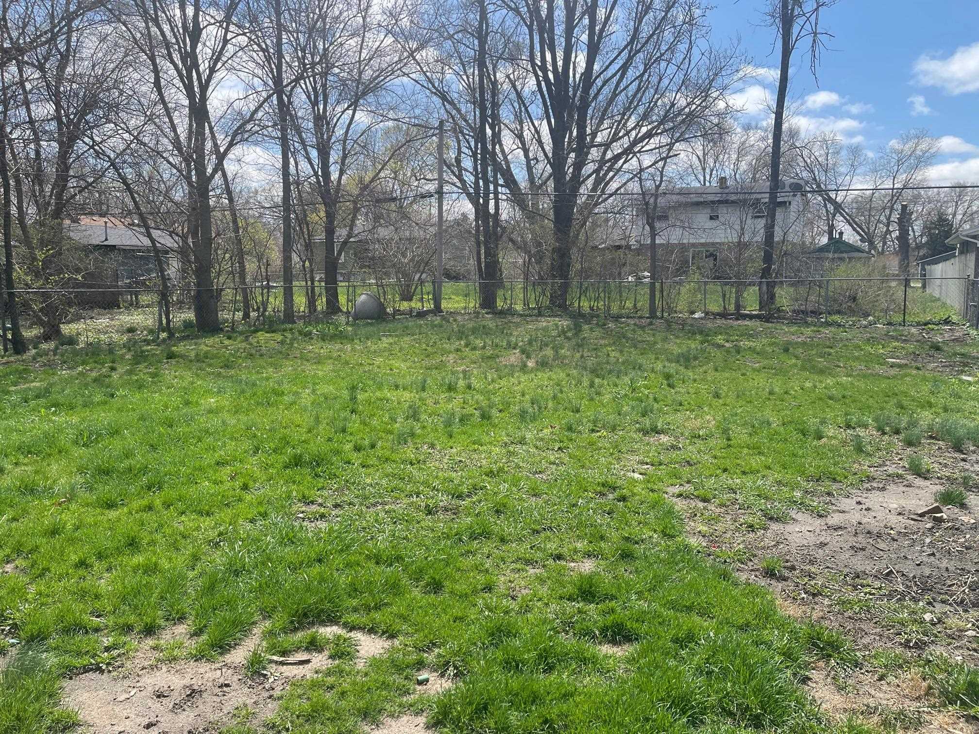 519 Brooke Road Rockford, IL 61109 - Photo 11 of 11 a view of a backyard with large trees