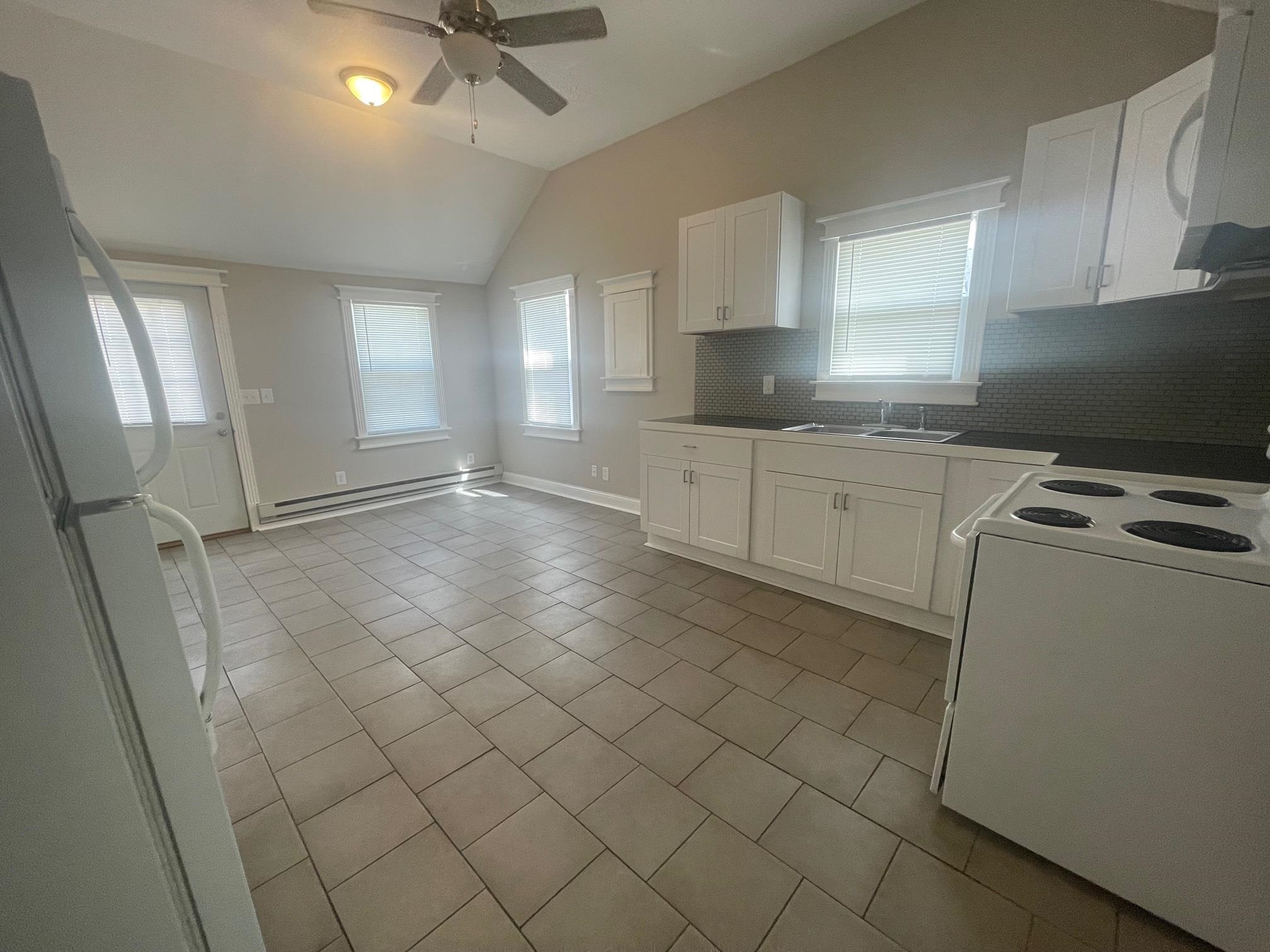 519 Brooke Road Rockford, IL 61109 - Photo 3 of 11 a kitchen with granite countertop cabinets a sink and appliances