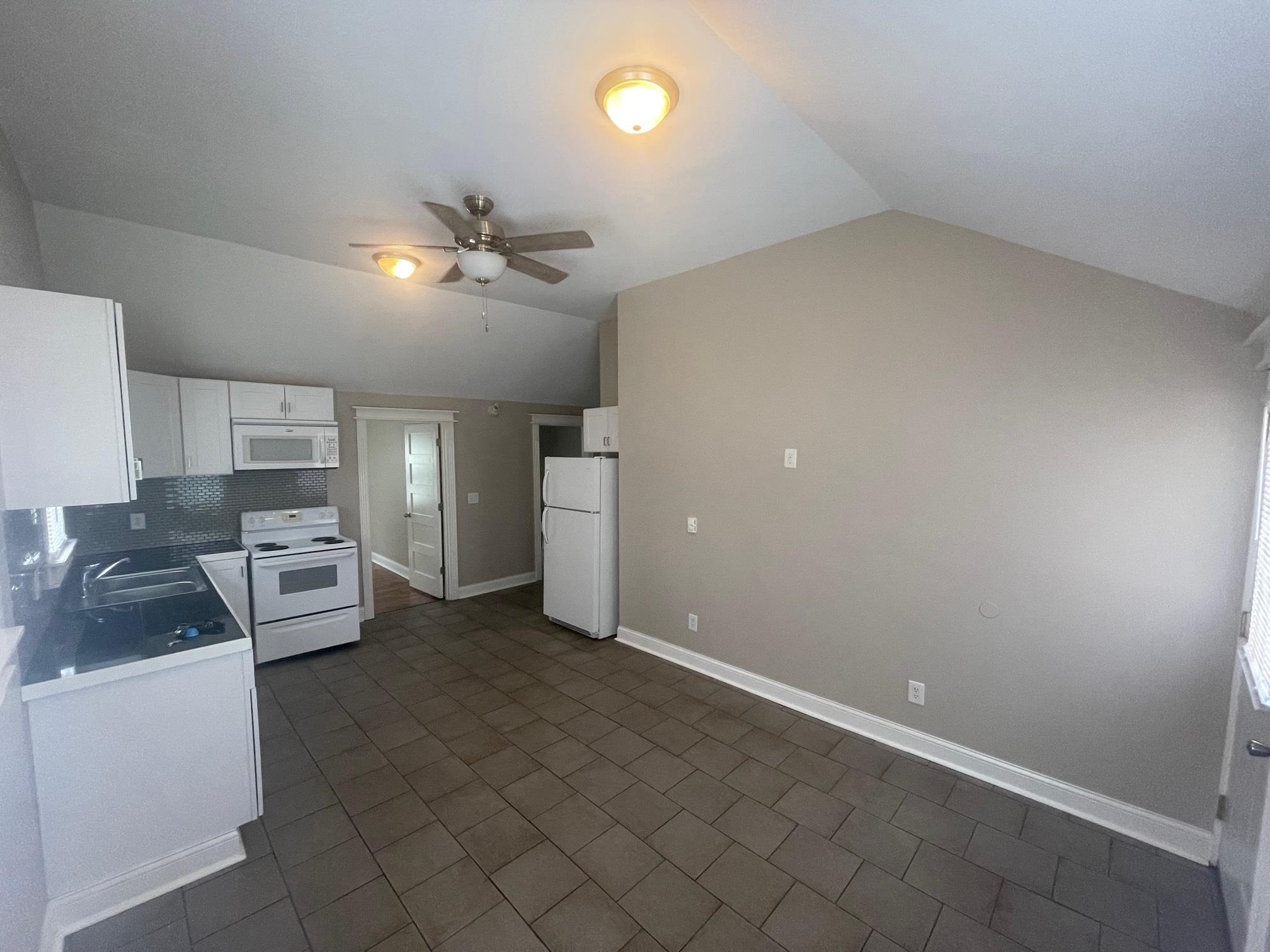519 Brooke Road Rockford, IL 61109 - Photo 4 of 11 wooden floor in an empty room with a window