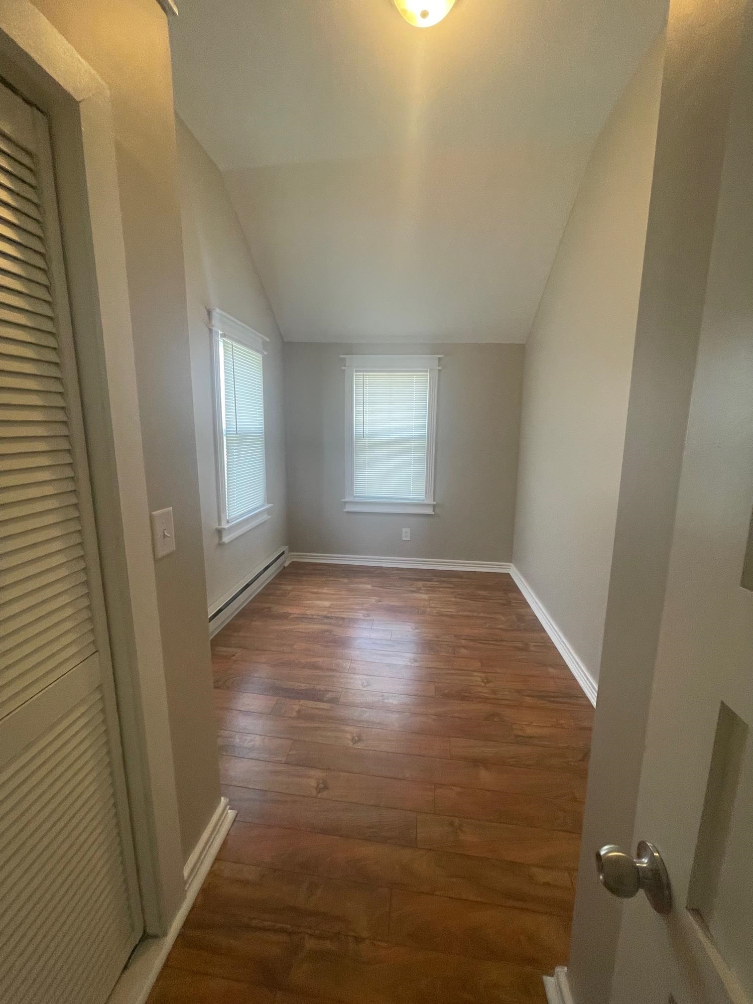 519 Brooke Road Rockford, IL 61109 - Photo 5 of 11 wooden floor in an empty room with a window