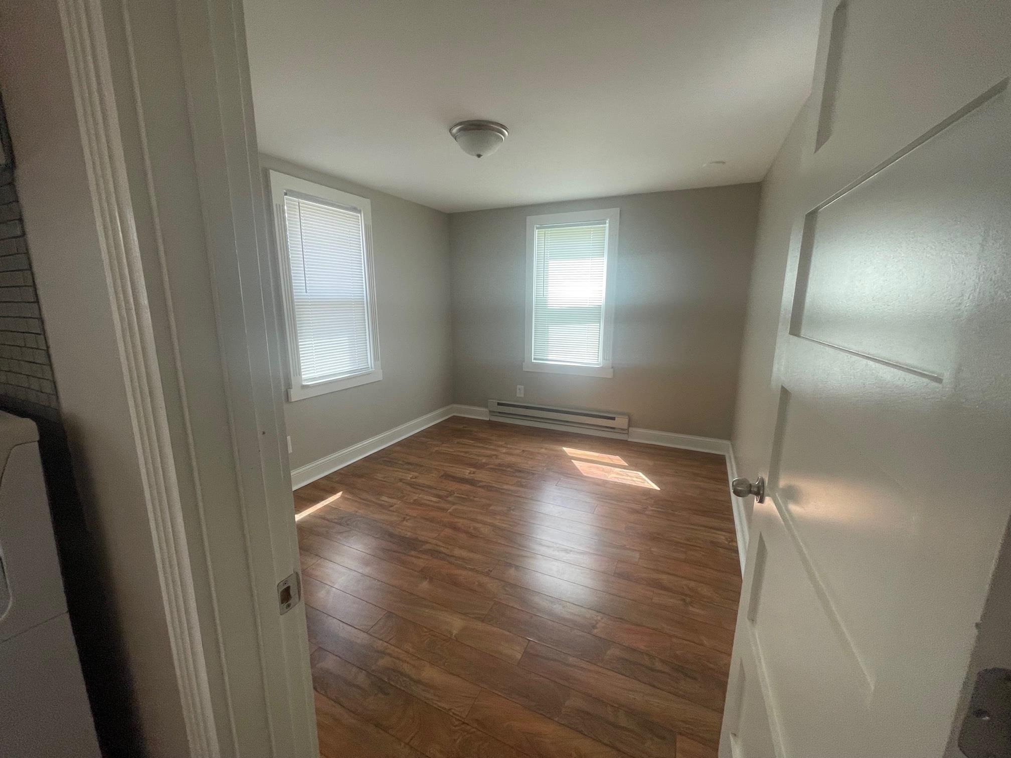 519 Brooke Road Rockford, IL 61109 - Photo 9 of 11 a view of wooden floor and windows in a room