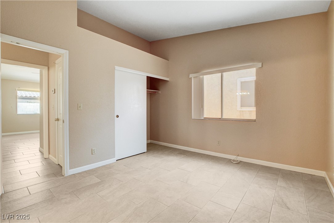 2824 Mayfair Avenue Henderson, NV 89074 - Photo 23 of 46 Bedroom featuring baseboards and a closet