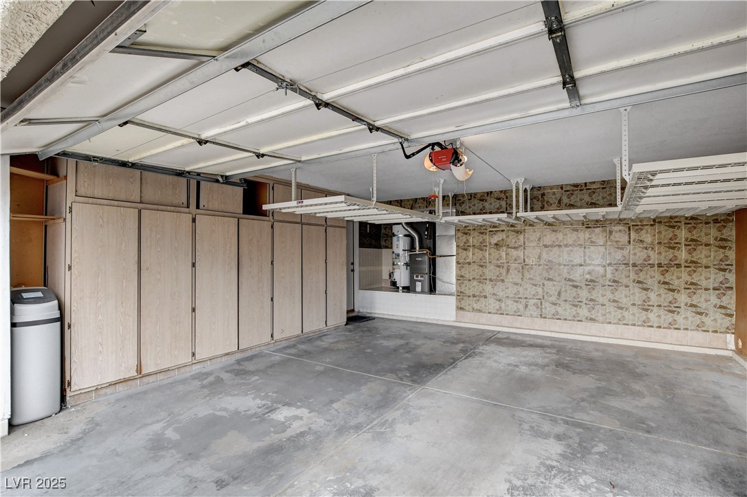 2824 Mayfair Avenue Henderson, NV 89074 - Photo 37 of 46 Garage featuring storage cabinets and garage door opener
