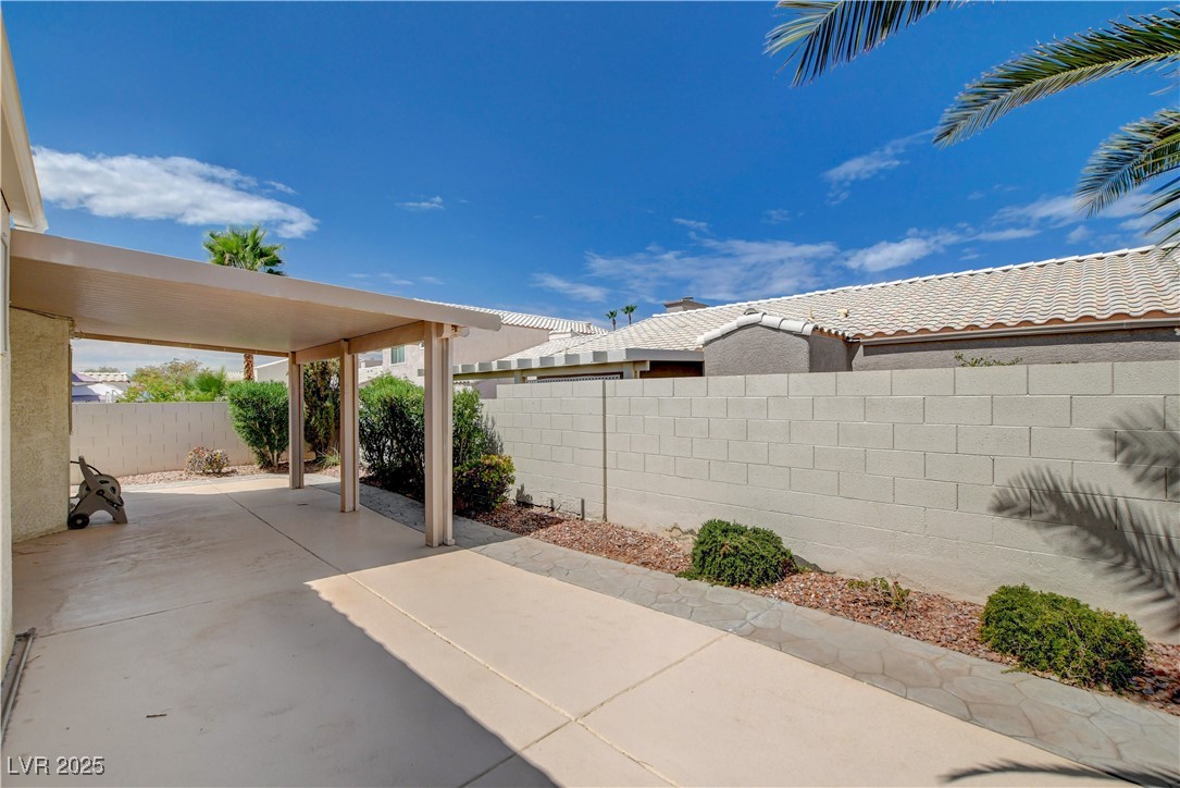 2824 Mayfair Avenue Henderson, NV 89074 - Photo 40 of 46 Fenced backyard featuring a covered patio