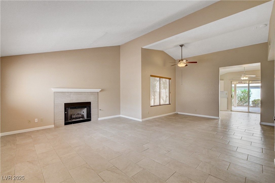 2824 Mayfair Avenue Henderson, NV 89074 - Photo 4 of 46 Living room with vaulted ceiling, a fireplace.