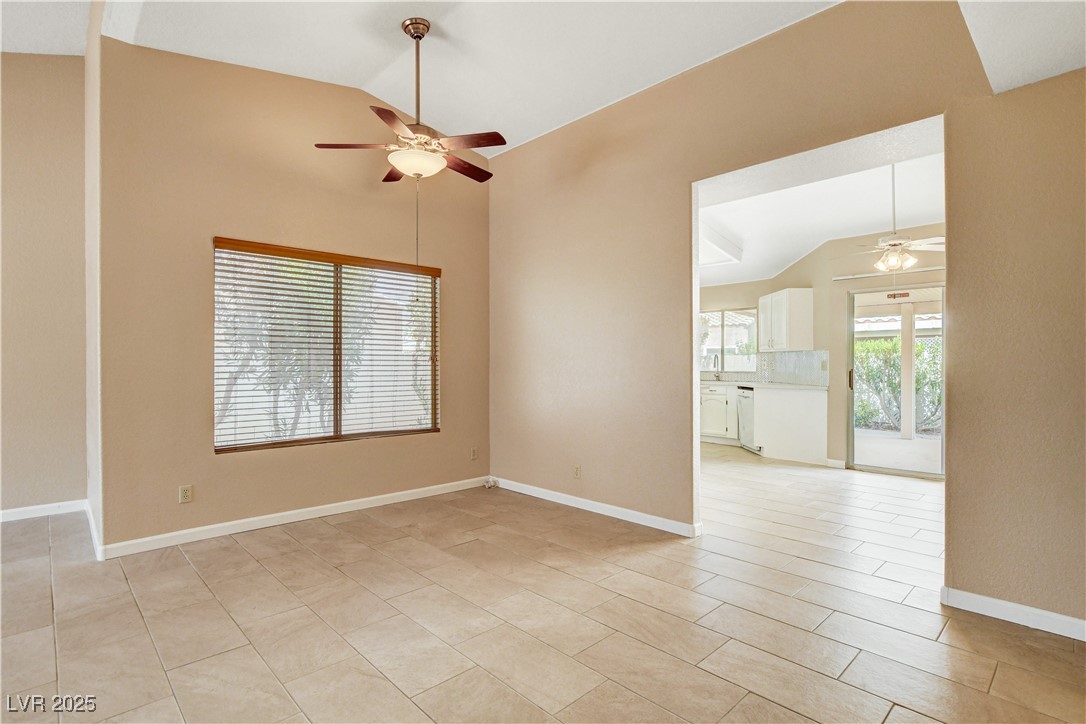 2824 Mayfair Avenue Henderson, NV 89074 - Photo 8 of 46 Vaulted ceiling,and ceiling light with fan.