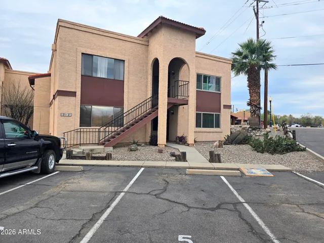 a couple of cars parked in front of a house
