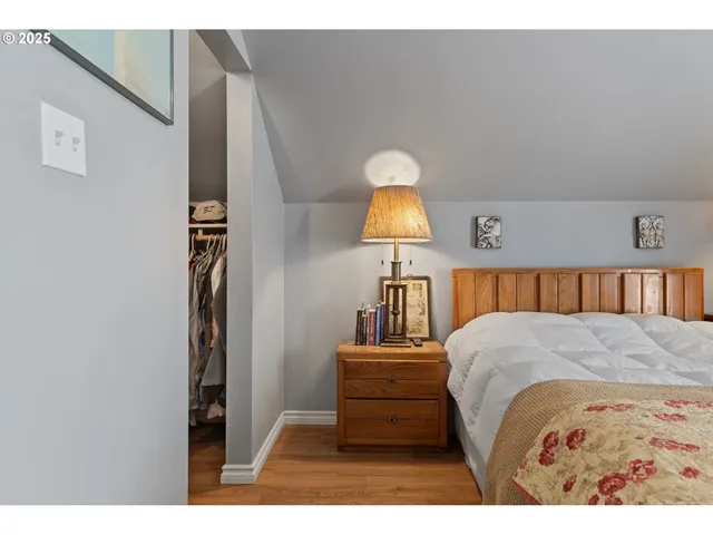 a bed room with a bed and a night stand