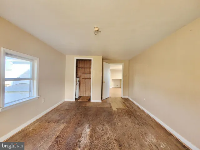 a view of an empty room and window