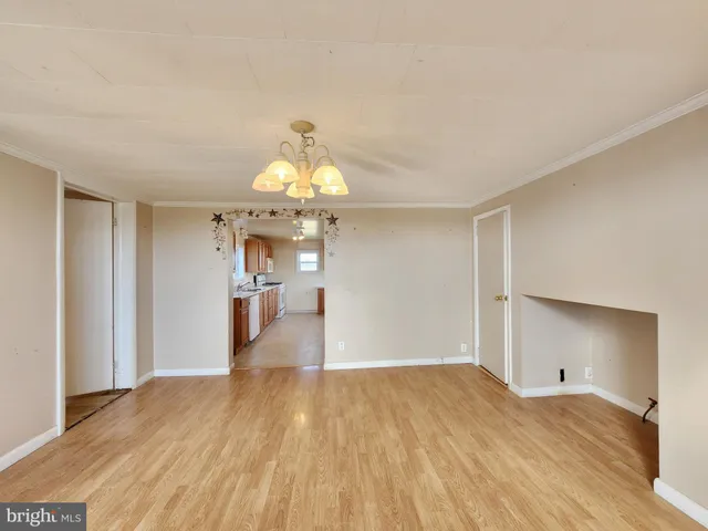 a view of a livingroom with wooden floor