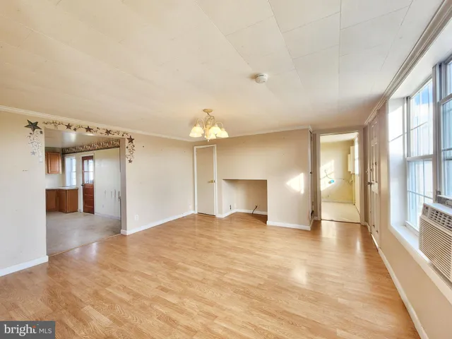 a view of a hallway with a chandelier